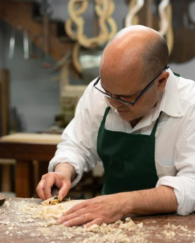 middle_aged_man_making_instruments_his_workshop_alone_2048x1365