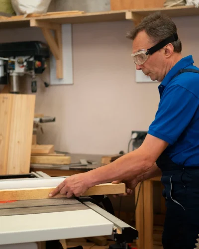 wood_worker_his_shop_working_with_tools_equipment_scaled